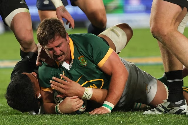 South Africa and New Zealand players in action during the Dubai 7s 2024 rugby match.