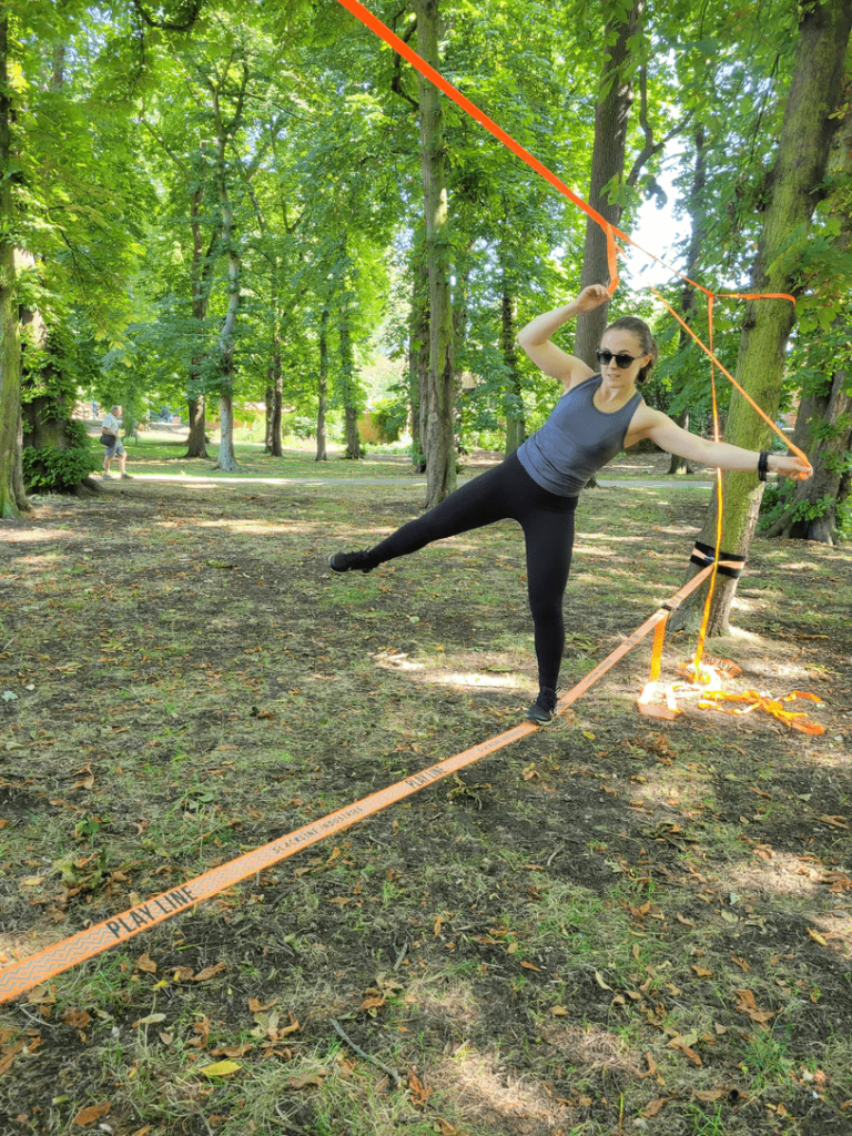 Adult slacklining in Dubai, focusing on strength and balance while engaging in this exciting outdoor sport.