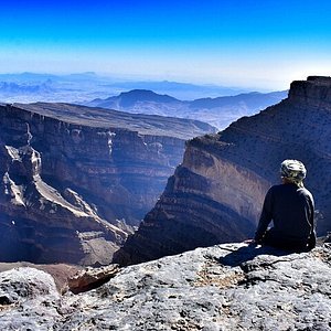 Wadi Ghul Grand Canyon of Oman with steep cliffs and deep valleys, perfect for adventurous hikers.