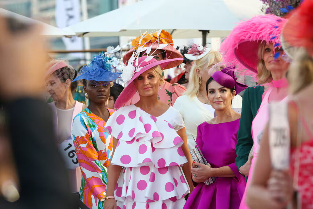 Fashionable attendees at Festive Friday Dubai 2024 showcasing the best of Dubai Racing Carnival style