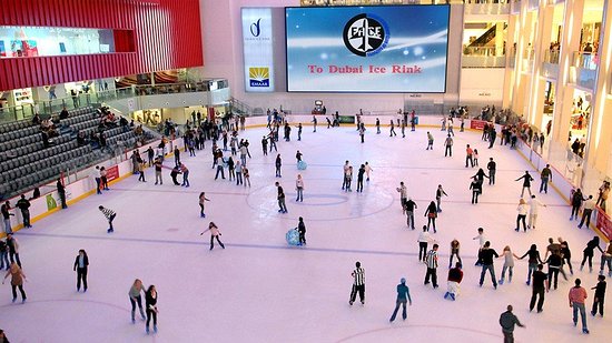 Ski Dubai Christmas experience with Santa meeting visitors and snowy slopes