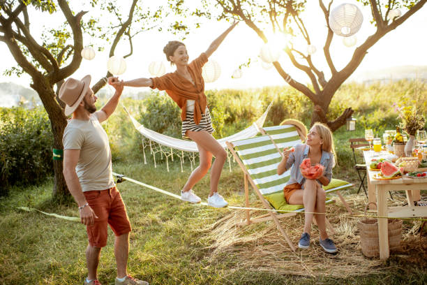 A family enjoying slacklining together at Safa Park, Dubai, strengthening bonds and improving balance