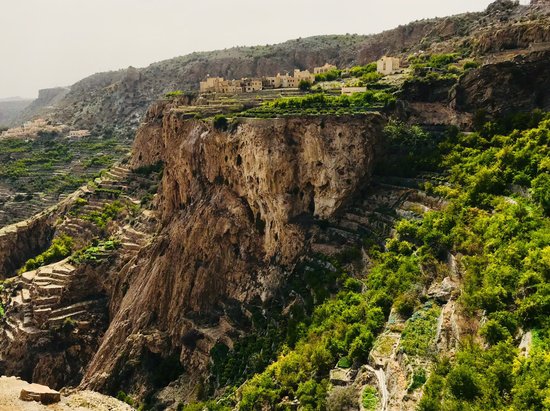 Jebel Akhdar hiking trail in Oman with terraced farms and breathtaking mountain views