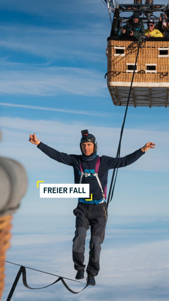 Aerial view of German slackliners breaking the world record at 2,500 meters above ground.