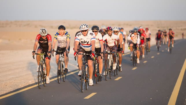 Cycling enthusiasts riding together at Al Qudra Cycling Track in Dubai