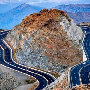 Cool juniper-covered trails in the Shafa Mountains of Taif, a high-altitude destination perfect for hiking in Saudi Arabia.
