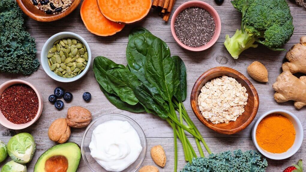 Heart healthy foods: berries, leafy greens, quinoa, and salmon.