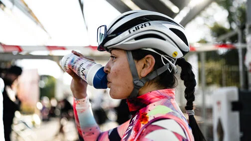Cyclist preparing for Build-Up Ride 4 with essential gear for Spinneys Dubai 92.