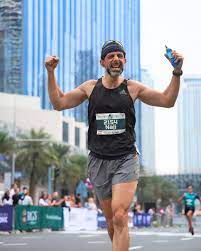 Runners crossing the finish line at Burj Khalifa during Burj2Burj Half Marathon 2025