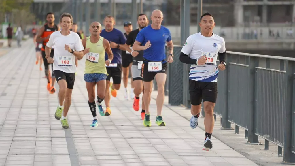 Families and children participating in the 1K fun run at the Sukoon & Bupa Global Dubai Canal Run 2025.