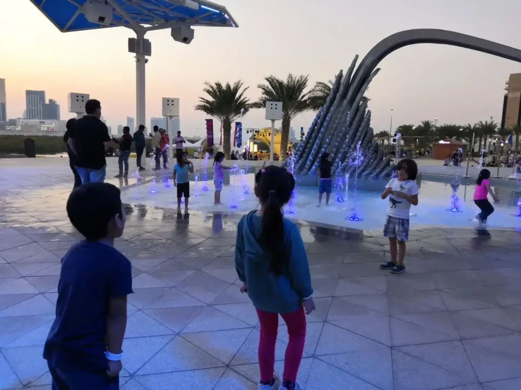 Kids splashing at Reem Central for parks for kids abu dhabi, 2025